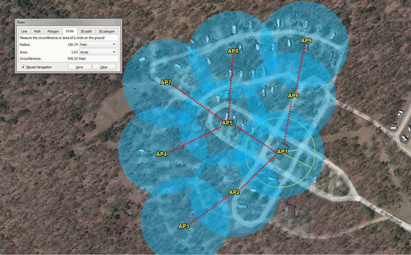 Satellite aerial of a wooded campground with labeled access points, blue coverage circles, and connecting paths.