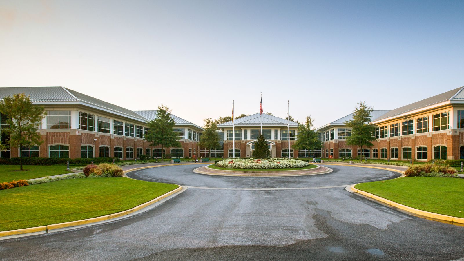 Campus buildings, lawns, and outdoor walkways on a large property.